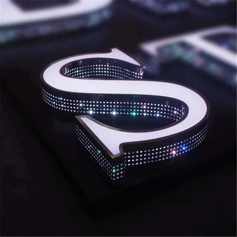Channel letter S with pixel LED illumination on a dark background, made by ALFA Signage